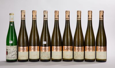six bottles of wine are lined up in a row on a table