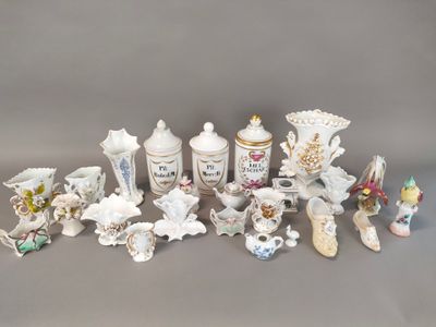 many different types of porcelain vases on the table