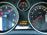 a close up of a speedometer and gauges in a car