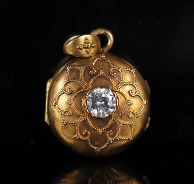 an image of a gold locke with a diamond in the center