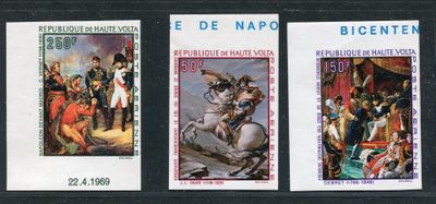 three stamps with a picture of a man on a horse and a man on a horse