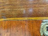 a close up of a door handle on a wooden door