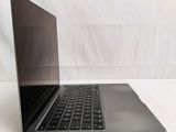 a laptop that is sitting on a white surface
