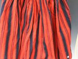 an orange and blue striped skirt on a mannequin mannequin mannequin mannequin mannequin mannequin mannequin mannequin