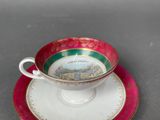a cup and saucer sitting on a saucer