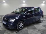 a blue car is parked in a room with a checkered floor