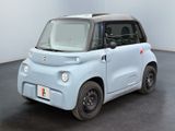 an image of a small electric car parked in a room