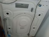 an image of a washing machine with a hose attached to it