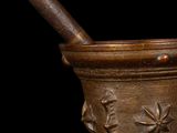 a mortar and a pestula on a black background