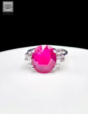 an image of a pink stone ring on a white plate