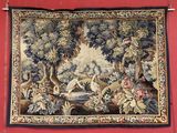 a tapestry hanging on the wall of a room