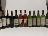 many bottles of wine lined up on a table