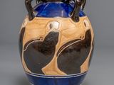 a blue and brown vase with black birds on it