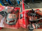 a red box with tools in it sitting on a table