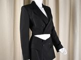 an image of a mannequin wearing a black suit