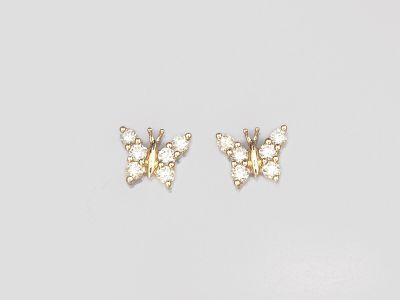 une paire de boucles d'oreilles papillon en or ornées de pierres blanches