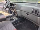 a dashboard of a car with a steering wheel and dashboard controls
