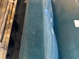a blue couch that is sitting on a table