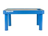 une table bleue pour enfants, avec un plateau et des pieds en bois