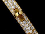 an image of a close up of a diamond bracelet on a black surface