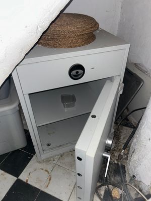 an image of an open safe box in a bathroom