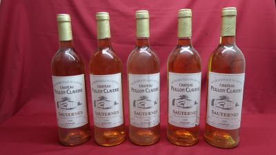 six bottles of wine are lined up on a red cloth