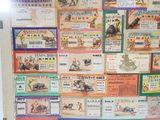 a refrigerator with a bunch of different types of tickets on it