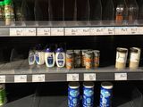 a lot of drinks on the shelves in the store