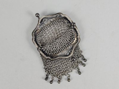 a close up of a metal object on a white surface