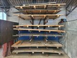 a large stack of wooden shelves in a warehouse