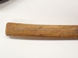 a wooden handle that is laying on a table