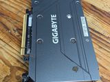 a close up of a video card sitting on top of a wooden table
