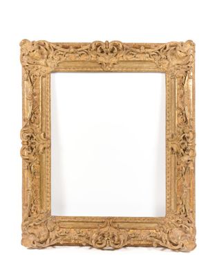 an antique gold frame with a decorative pattern on the edges