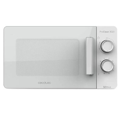 un micro-ondes blanc qui se trouve sur une surface blanche