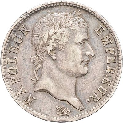 a close up of a coin with a man ' s face on it