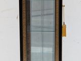a small display case with a clock inside of it
