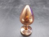 an image of a small copper object sitting on a table