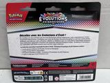 a close up of a box of pokemon evolutions cards on a table