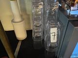 a microwave that has a bunch of wine glasses in it