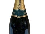 bottle of champagne on a white background with a gold cap