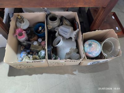 two boxes that have various items inside of them