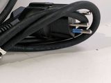 cables connected to a laptop computer sitting on a white surface