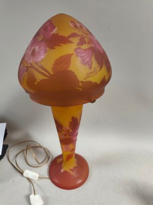 a lamp that is sitting on a table next to a charger