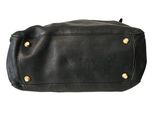 a black leather purse with gold studded handles
