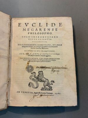 an open book with a drawing of a man riding a horse