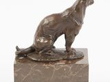 bronze sculpture of a cat on a marble base