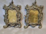 pair of antique silver picture frames on a white background