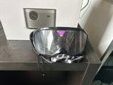 a pair of goggles sitting on a table next to a camera