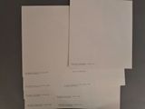 two sheets of paper sitting on top of each other