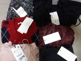 a pile of clothing that is sitting on the floor